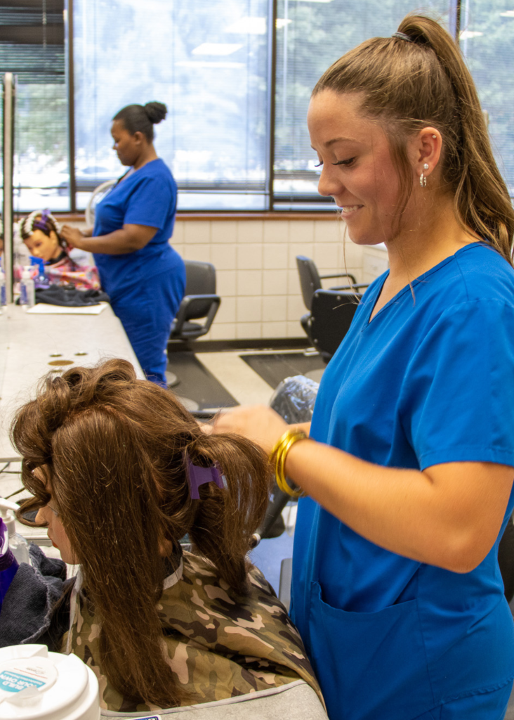 Cosmetology Student fixing hair