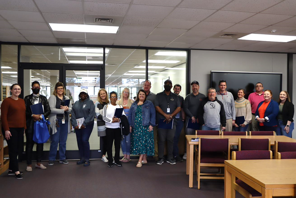 Clinton High School staff and SCC staff pose for photo at learning summit