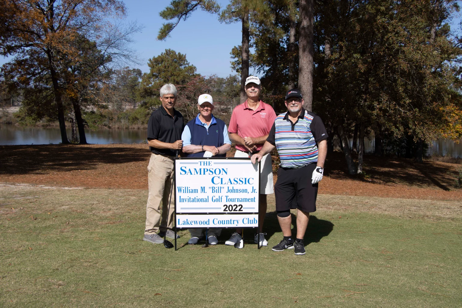 Sampson Classic team pose with sign