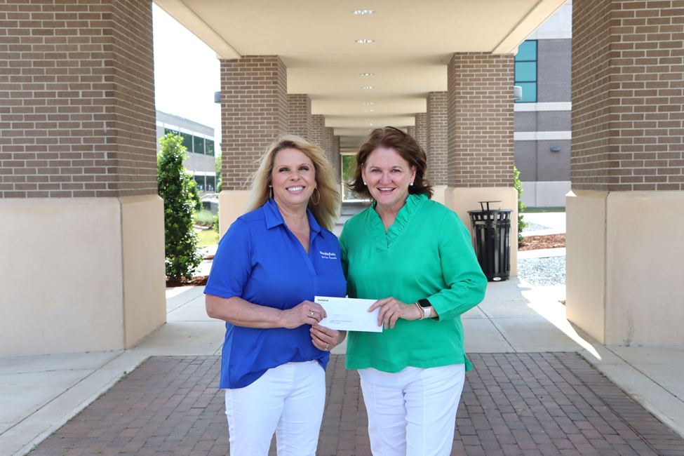 Smithfield foods presents Lisa Turlington with scholarship check