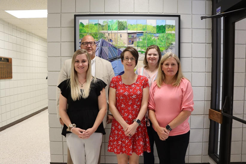 (Back from left) 5 years of service: Dr. Bill Starling, SCC President, poses with Krista Wiggins, (Front from left) Amelia Elmore, Melissa Carter, and Jacquie Ammons.