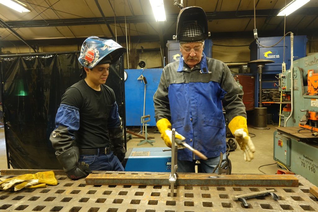 Welding student Mauricio Leon with instructor Dale Godbold