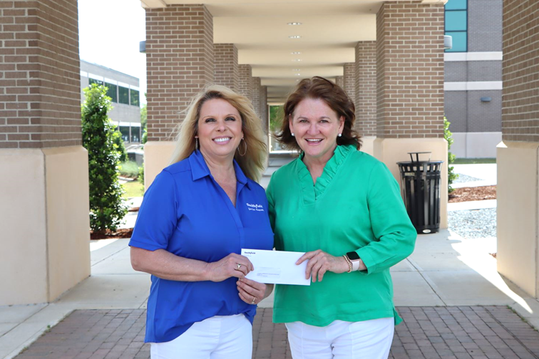 Smithfield foods presents Lisa Turlington with scholarship check